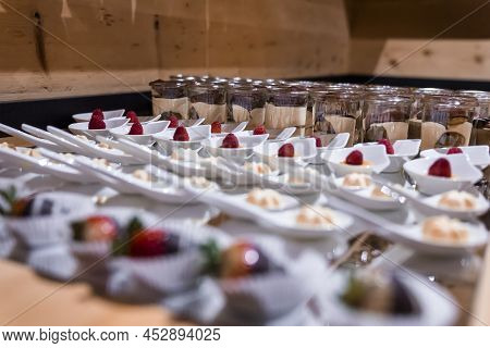 Various Confectionery And Chocolate Pudding Arranged On Counter At Ski Resort