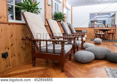 Cozy Chairs Arranged In Elegant Waiting Room At Luxurious Ski Resort