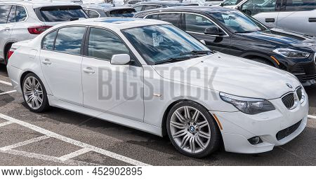 Monroeville, Pennsylvania, Usa April 10, 2022 A White Bmw Sedan For Sale At A Dealership On A Sunny 