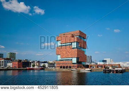ANTWERP, BELGIUM - MAY 26, 2018: MAS (Museum aan de Stroom - Museum by the River) on river Scheldt. Opened in 2011, is the largest museum in Antwerp and an example of postmodern Art Deco architecture