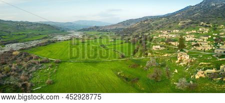 Panorama Of Dhiarizos River Valley In Cyprus With Green Fields And Souskiou Abandoned Village