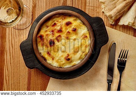 Traditional Georgian Baked Suluguni In Clay Ketsi With Creamy Sauce