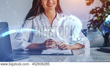 Businesswoman Working In Office Room, Laptop And Contract On Table. Metaverse And Earth Globe With L