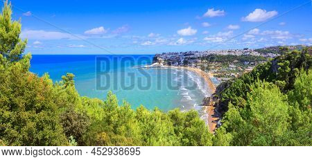 Bay Of Peschici In Apulia, Italy: View Of Townscape And Sandy Beach. Peschici Is Famous Town For Its