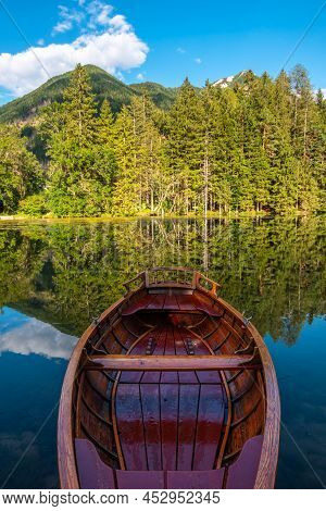 A Boat On The Scenic Mountain Lake Plansansko Jezero At Jezersko, Slovenia