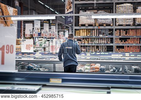Chisinau, Moldova - January 23, 2022: An Employee Of The Metro Cash Carry Family Shopping Market Is 