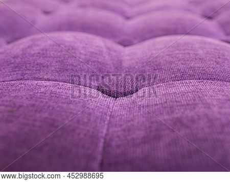 Upholstery Of Velour Buttoned Purple Violet Color Fabric, Wall Pattern. Elegant Vintage Quilted Sofa