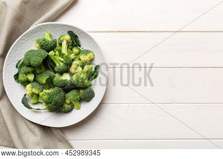 Broccoli Of Fresh Green Broccoli In Bowl Over Coloredbackground. , Close Up. Fresh Vegetable.