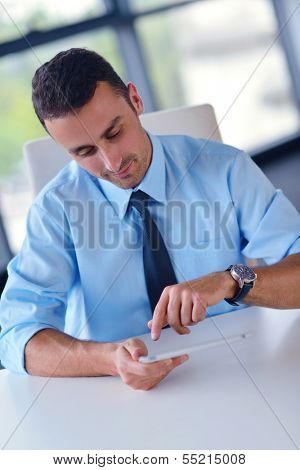 close-up of human hand  business man using tablet compuer at office