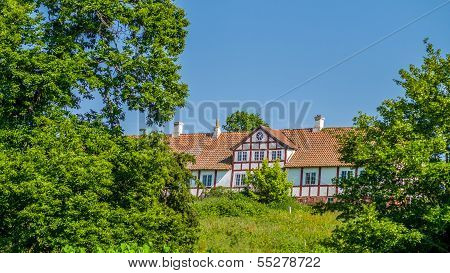 Old Withe Half Timbered Farm In Romantic Landscape