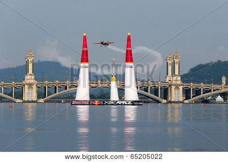 PUTRAJAYA, MALAYSIA - MAY 17, 2014: Nicolas Ivanoff from France flying in an Edge 540 V2 plane enters the race course at the Red Bull Air Race World Championship 2014 in Putrajaya.