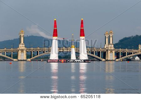 PUTRAJAYA, MALAYSIA - MAY 17, 2014: Nicolas Ivanoff from France flying in an Edge 540 V2 plane enters the race course at the Red Bull Air Race World Championship 2014 in Putrajaya.