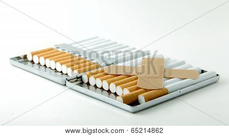 A pack of cigarettes with an X made from bandages