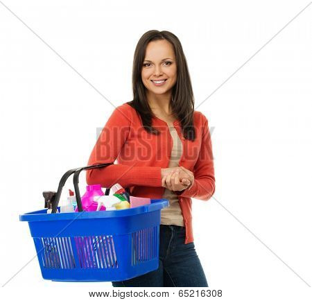 Beautiful cheerful brunette woman with basket full of cleansers 