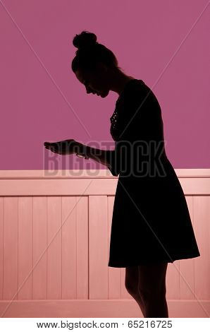 silhouette of a women showing something