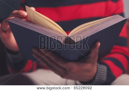 Man Is Reading A Big Book