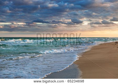 sunrise over the ocean and the beach