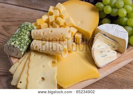 Cheese Plate Variation On A Wooden Table