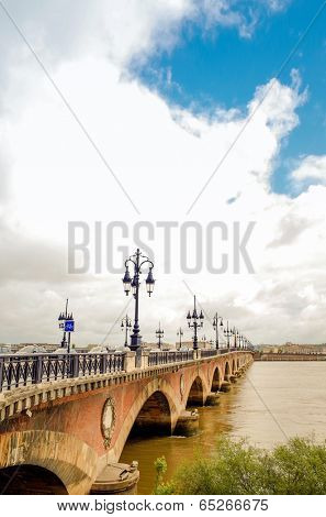 Old stony bridge in Bordeaux, France Europe
