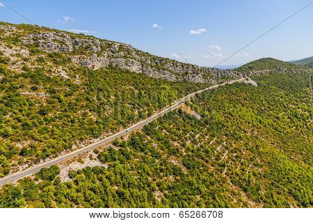 Strait road through the macchia landscape