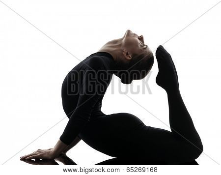 one  woman contortionist practicing gymnastic yoga in silhouette on white background
