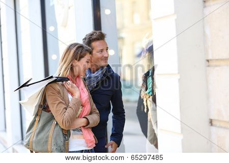 Middle-aged couple doing shopping on week-end