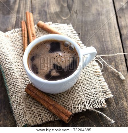 Cup Of Coffee With Cinnamon Sticks