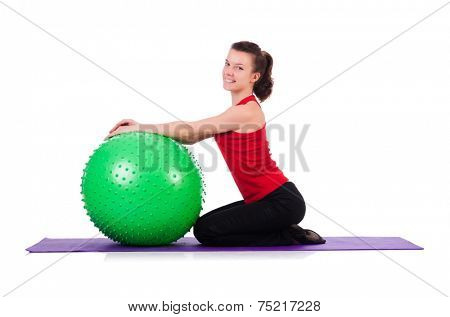 Young woman exercising with swiss ball