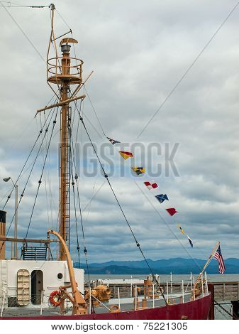 Columbia Lightship Main Light With Nautical And American Flags Hanging