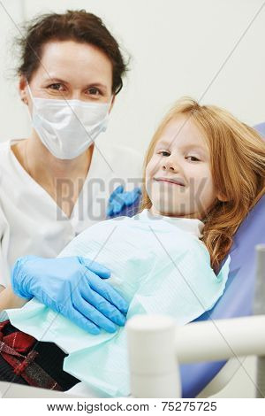 dentist orthodontist female doctor wich child client at working place