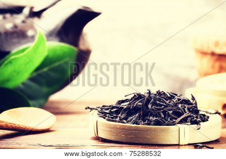Closeup Of Black Tea And Teapot