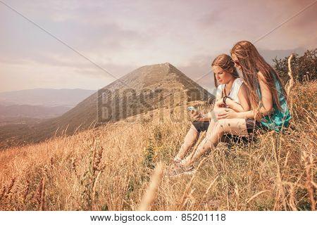 Girls in nature with smart phone