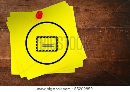 Envelope graphic against sticky note with red pushpin