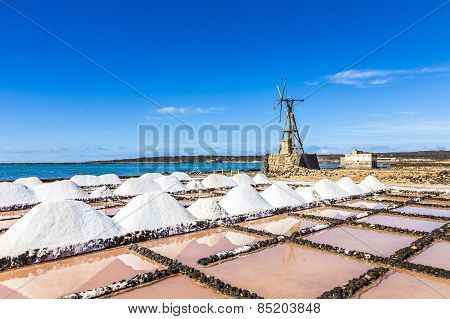 Salt Piles In The Saline Of Janubio In Lanzarote With Old Toteen Wind Mill