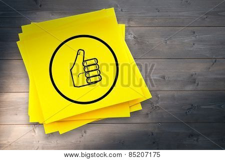 Thumbs up graphic against sticky note