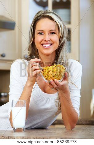 Young woman eating cereals. Healthy diet and nutrition.