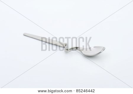 empty squiggly spoon on white background