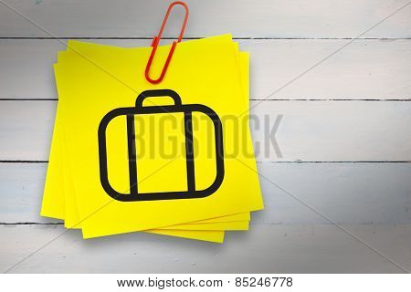 Briefcase graphic against sticky note with red paperclip