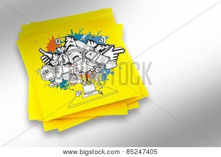 Computer icons and arrows on paint splashes against sticky note