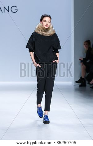 NEW YORK - FEBRUARY 16: A model walks the runway at the Taoray Wang Fall/Winter 2015 collection during Mercedes-Benz Fashion Week in New York on February 16, 2015.