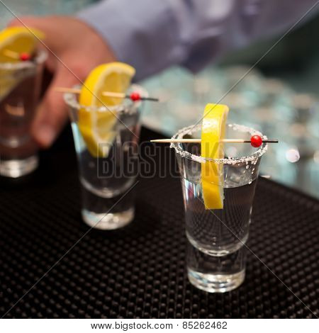 Three Tequila Shots With Lemon