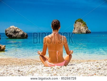 Beautiful relaxed young  woman has a meditation. Greece.