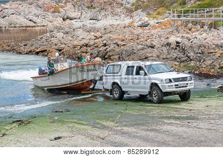 Crayfish Boat Being Pulled Onto Trailer At Kleinmond Harbor