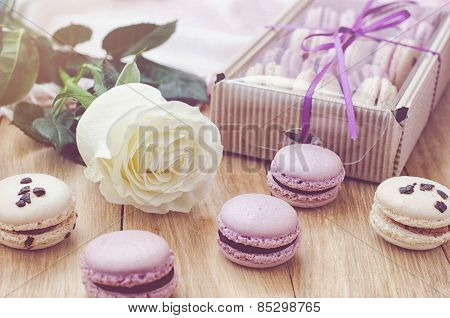 Lilac macaroons with rose and gift box