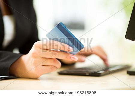 Business Woman Holding Credit Card On Laptop For Online Payment Concept