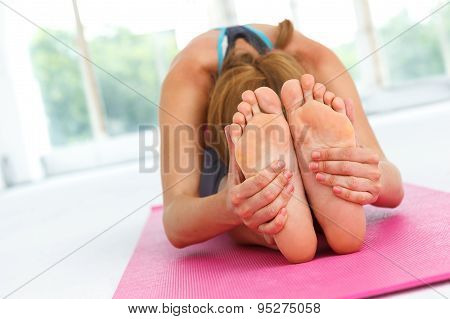 Young Woman Stetching After Workout.