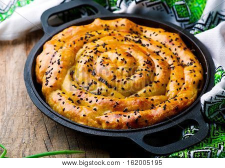 Vertuta - spinach feta spiral traditional Moldavian pie. style rustic. selective focus