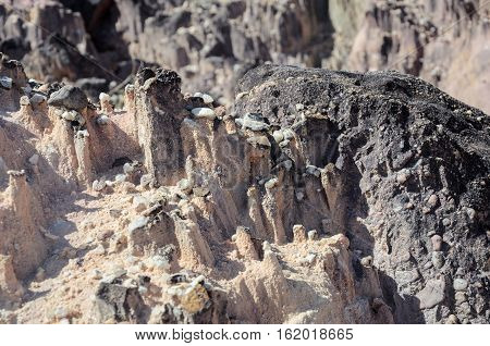 Formations Made By Rainwater On Sandy Rocks. The Rainwater Hits The Stone's Edge Forming These Point