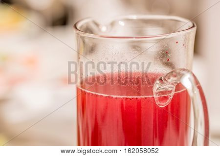 Traditional Russian drink mors made of berry and fruit smoothie in jar