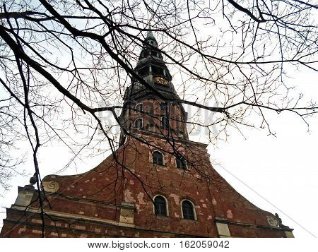 The tower of St. Peter's Church in Old Riga against the sky, December 2016 in Latvia
